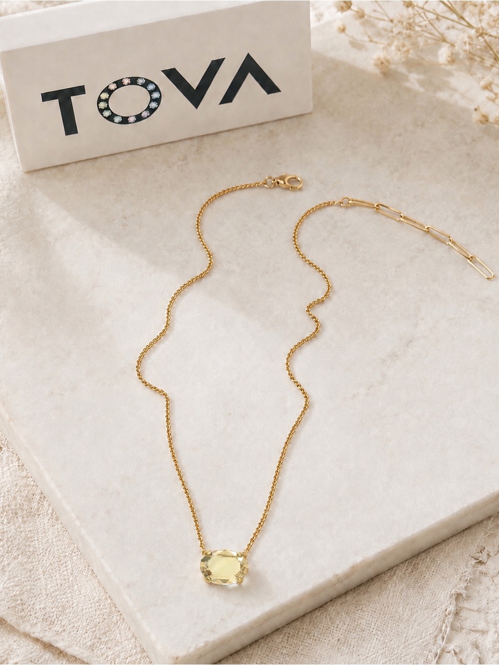 TOVA IZA golden shadow pendant on a gold Chain Necklace.